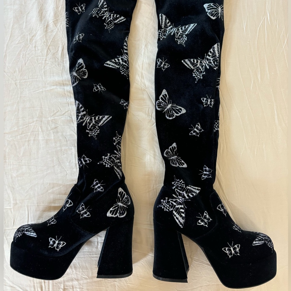 Delia’s thigh high butterfly platform boots